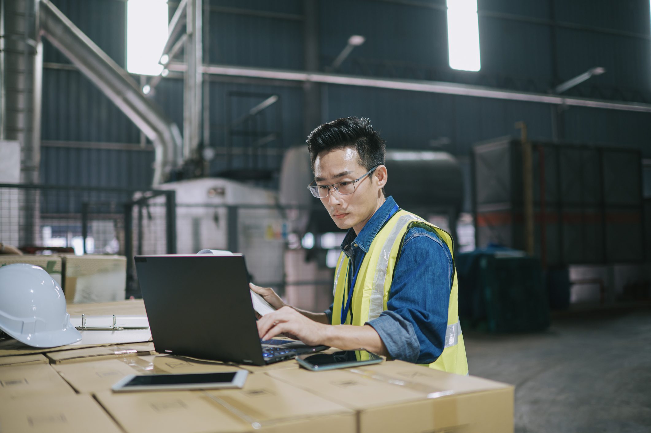 A semi-truck crosses through a border checkpoint for international freight delivery between North American countries, representing cross-border shipping.